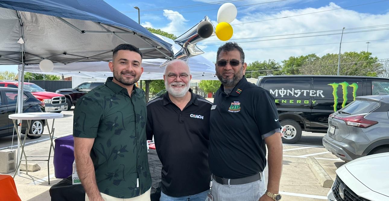 With franchisees at a community store event.